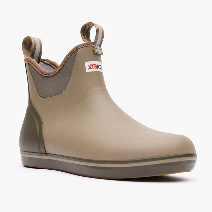 Beige rubber boot with Xtratuf logo on a white background