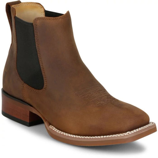 Brown leather boot with a block heel on a white background