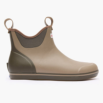 Beige rubber boot with brown trim on a white background